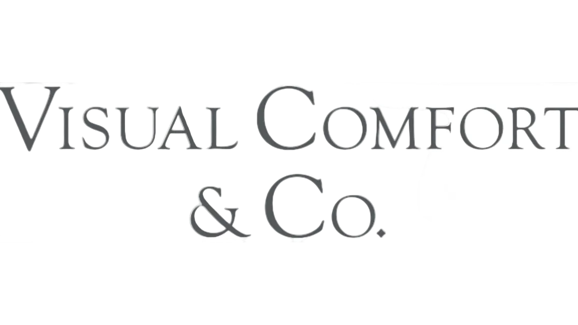 The text 'Visual Comfort & Co.' in a dark gray serif font on a light gray and white checkered transparency-style background.